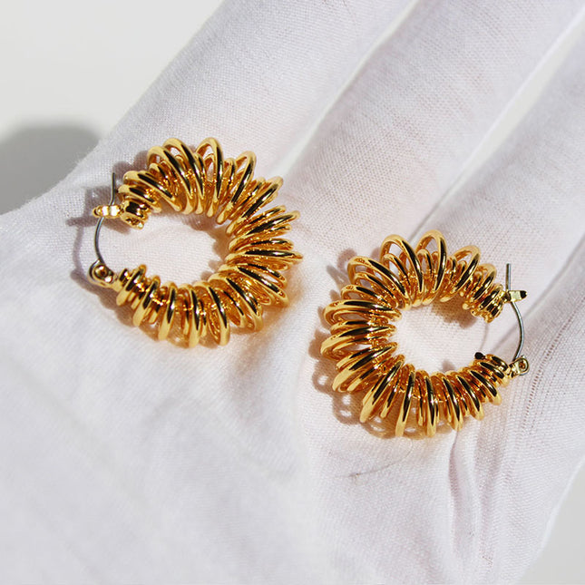 Brass gold plated European and American personality spiral Hollow spring earrings winding line POHO big ear ring earrings 553
