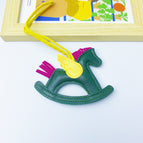 Dark green rocking horse bag pendant