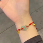 Interlocking red braided bracelet