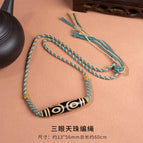 Three-eyed dzi bead