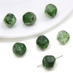 5 p/bag / Irregularly cut beads 12x 12mm aperture about 1mm green
