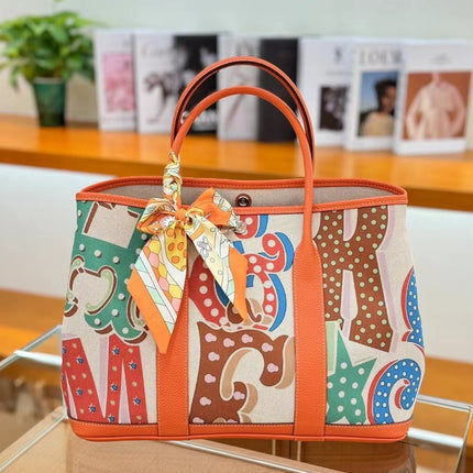 2025 New Canvas Top Layer Cowhide Women's Bag Garden Handbag Large Capacity Genuine Leather Contrast Shoulder Tote Bag