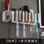 4 cups gray and white toothpaste squeezer