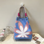 Carry bag with seven-petal flower on blue background