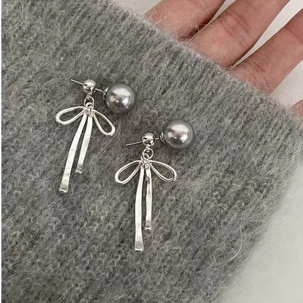 925 Silver Needle Korean and Japanese Summer Faux Pearl Bowknot Earrings Simple French Style Versatile 2026 New Women's Earrings