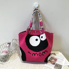 Handbag with big eyes on red background