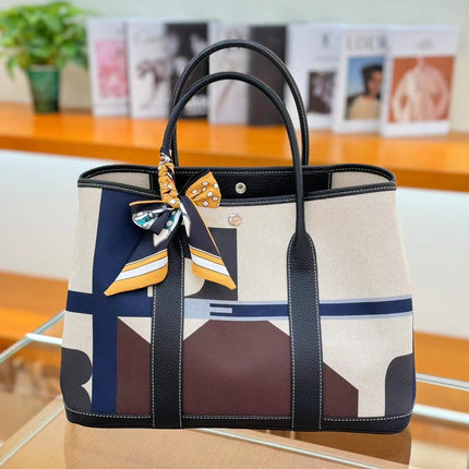 2025 New Canvas Top Layer Cowhide Women's Bag Garden Handbag Large Capacity Genuine Leather Contrast Shoulder Tote Bag