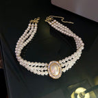 White multi-layered pearls gold