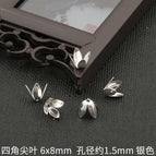 10 p/bag / Four pointed blades 6x 8mm aperture about 1.5mm silver