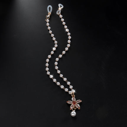 Cross-border hot selling simple pearl tassel double nipple chain flower pendant European and American nightclub disco body chain accessories for women