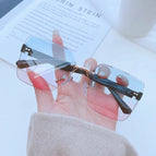 Black gold frame blue powder tablet / Sunglasses