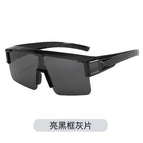 Glossy black frame, grey lens