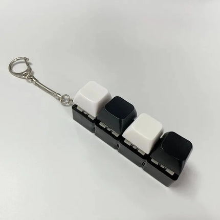 New Stress Anxiety Relief Keyboard Keychain Four Finger Button for Office Home Adults Kid Decompression Clicker Hot Gadget Gifts