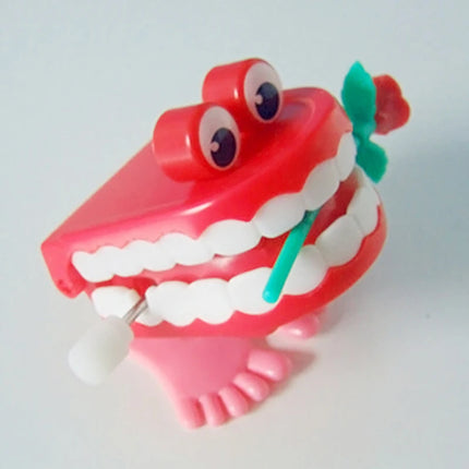 1pcs Clockwork Toy Upper Chain Jumping Tooth Toy Jump Teeth Running Clockwork Spring Wind Up Toy