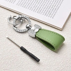 green-silver ring