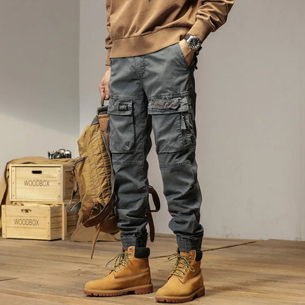 The new men's American retro sporty design in 2025 features multi-pocket, versatile drawstring work pants and stretch trousers