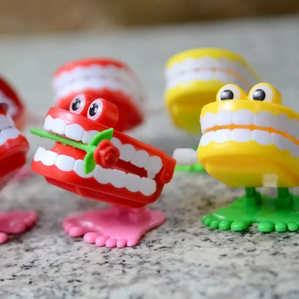 1pcs Clockwork Toy Upper Chain Jumping Tooth Toy Jump Teeth Running Clockwork Spring Wind Up Toy