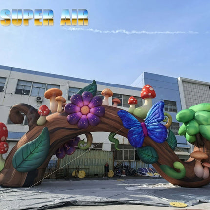 Inflatable Forest Tree Trunk Arch with Colorful Mushroom Butterfly Flower Giant Inflatable Entrance Arch for Theme Park Event Pa