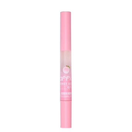 Peach Lip Oil, enriched with plant-based squalane, contains vitamin E and glycerin for long-lasting hydration and soft lips.