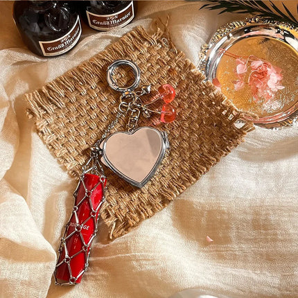 Hot Sale Original Design Bag Pendant Ins Popular Silver Love Mirror Metal Mesh Lipstick Storage Keychain Ring Cross Border