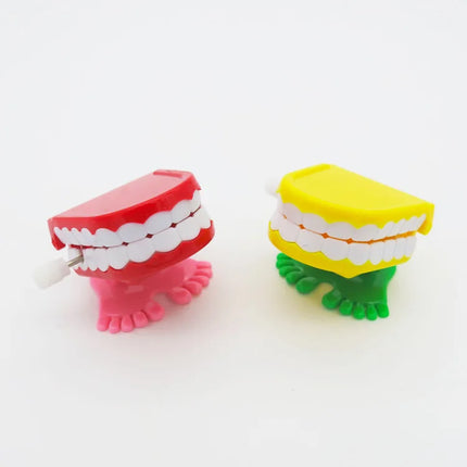 1pcs Clockwork Toy Upper Chain Jumping Tooth Toy Jump Teeth Running Clockwork Spring Wind Up Toy