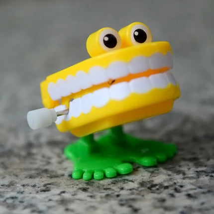 1pcs Clockwork Toy Upper Chain Jumping Tooth Toy Jump Teeth Running Clockwork Spring Wind Up Toy