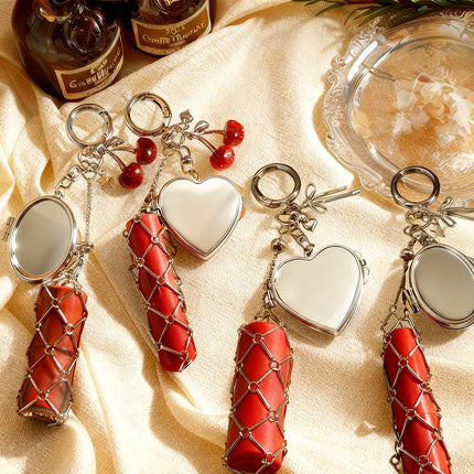 Hot Sale Original Design Bag Pendant Ins Popular Silver Love Mirror Metal Mesh Lipstick Storage Keychain Ring Cross Border