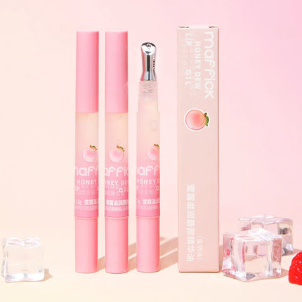 Peach Lip Oil, enriched with plant-based squalane, contains vitamin E and glycerin for long-lasting hydration and soft lips.