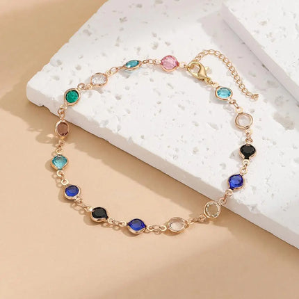 Kinitial Exquisite and fashionable laser plated anklet with black, blue, and multicolored white stones as an anniversary gifts