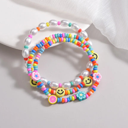 3-piece set of Bohemian style colorful rice beads mixed with smiling face pearls, multiple layered women's anklets