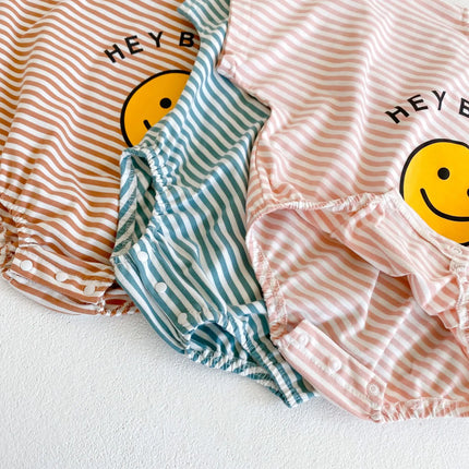 Summer style baby girl jumpsuit with cotton short sleeves, smiley face printed stripes, and a climbing suit