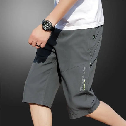 2025 New Men's Seven point Ice Silk Zipper Pocket Casual Pants Breathable Elastic Fabric Slimming Version Summer Outdoor Vacatio