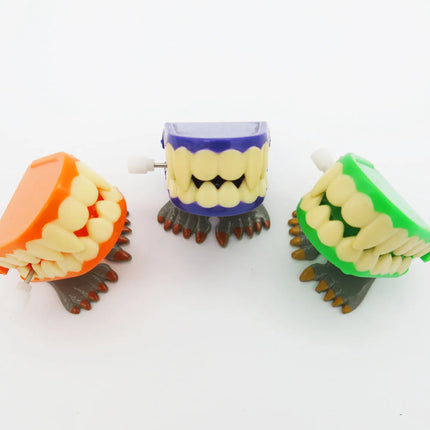 1pcs Clockwork Toy Upper Chain Jumping Tooth Toy Jump Teeth Running Clockwork Spring Wind Up Toy