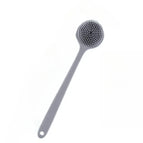 Grey shower brush