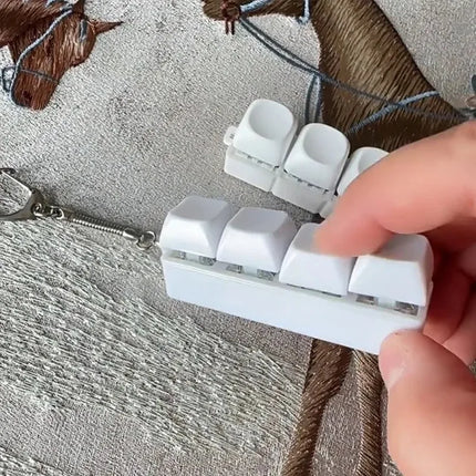 New Stress Anxiety Relief Keyboard Keychain Four Finger Button for Office Home Adults Kid Decompression Clicker Hot Gadget Gifts