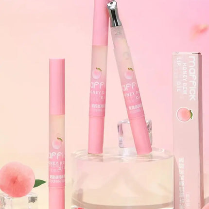 Peach Lip Oil, enriched with plant-based squalane, contains vitamin E and glycerin for long-lasting hydration and soft lips.