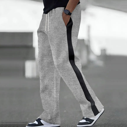 Spring and Autumn of men's casual pants will be a major release: loose color-blocking and sporty straight-leg sweatpants