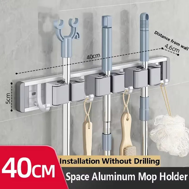 2026 New Toilet Kitchen Storage Rack Mop Clip Rack Strong Mop Holder Self Adhesive for Home Bathroom Cleaning Tools Storage