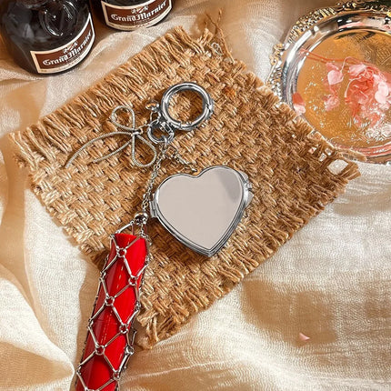 Hot Sale Original Design Bag Pendant Ins Popular Silver Love Mirror Metal Mesh Lipstick Storage Keychain Ring Cross Border