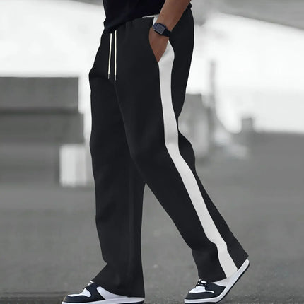 Spring and Autumn of men's casual pants will be a major release: loose color-blocking and sporty straight-leg sweatpants