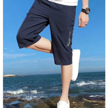 2025 New Men's Seven point Ice Silk Zipper Pocket Casual Pants Breathable Elastic Fabric Slimming Version Summer Outdoor Vacatio