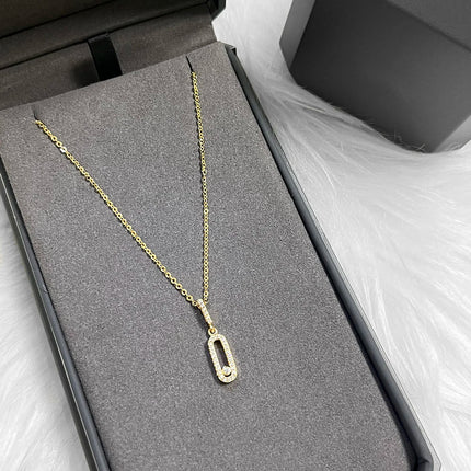 Minimalist long oval zircon pendant necklace with delicate tassel chain; stylish everyday party accessory.