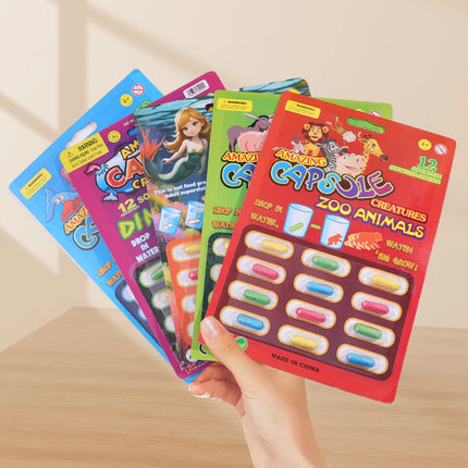 12pcs/set Creative Soaking Water Expands To Large Sponge Capsule Toys Dinosaur Sea Animal Shape Kids Bath Swimming Puzzle Toys
